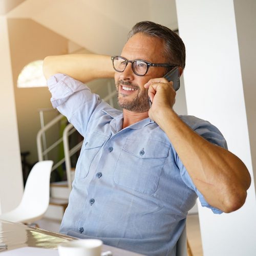 Home-office businessman talking on phone